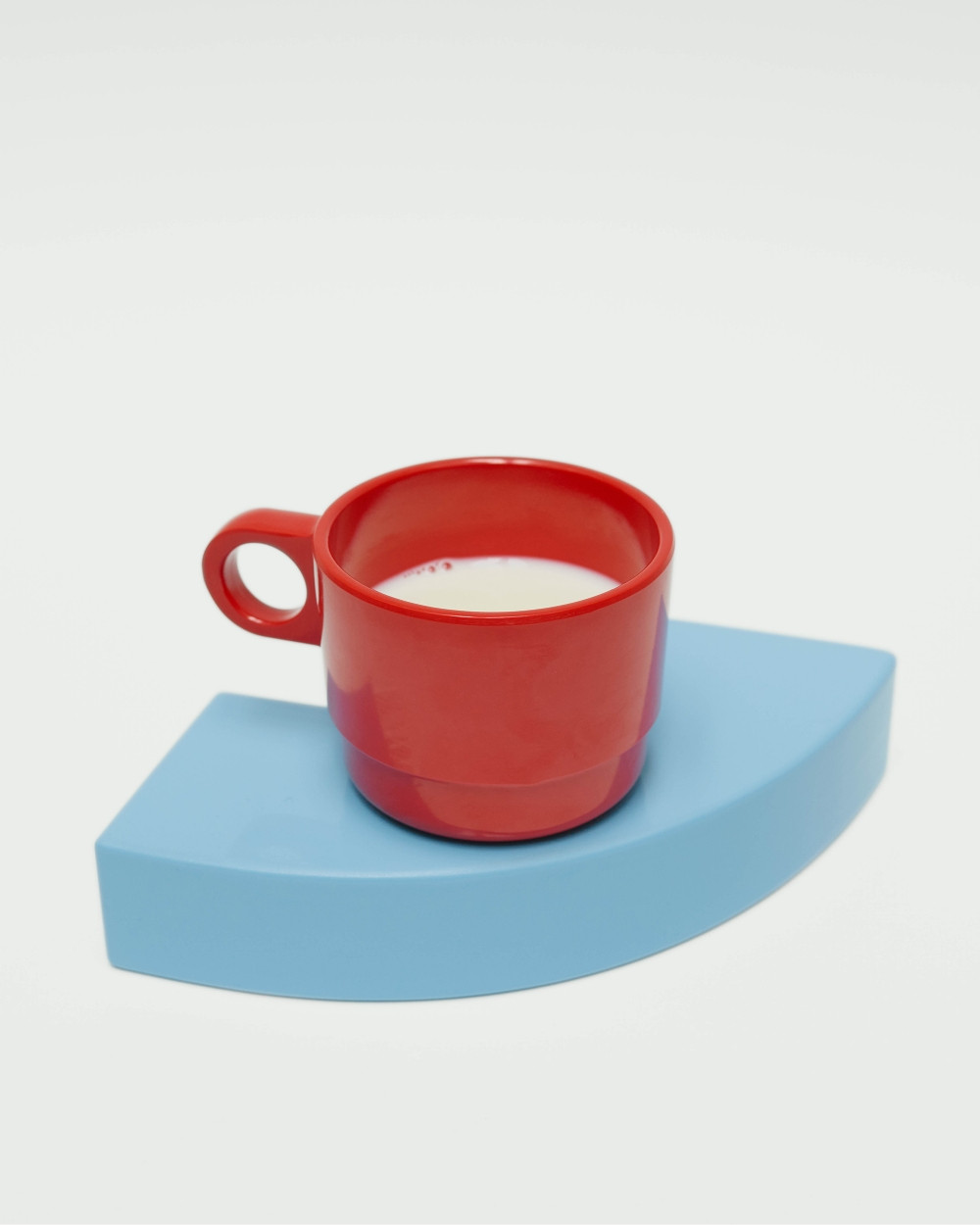 Pieces from Little Family used as tray by nara.world, red cup on blue geometric base