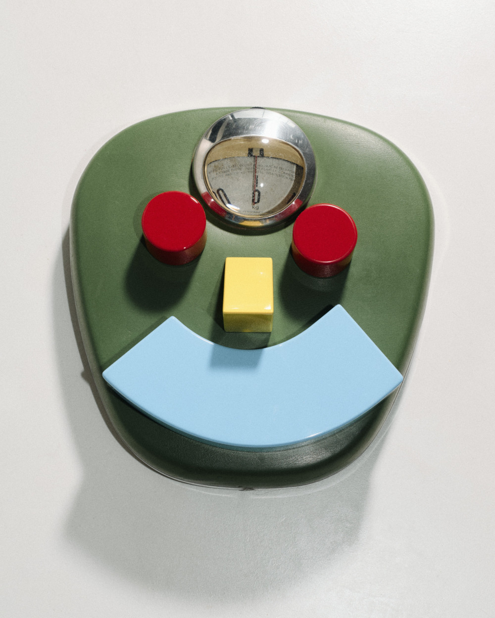 The collection's smaller modular pieces by nara.world arranged playfully on a bathroom scale forming a face-like composition