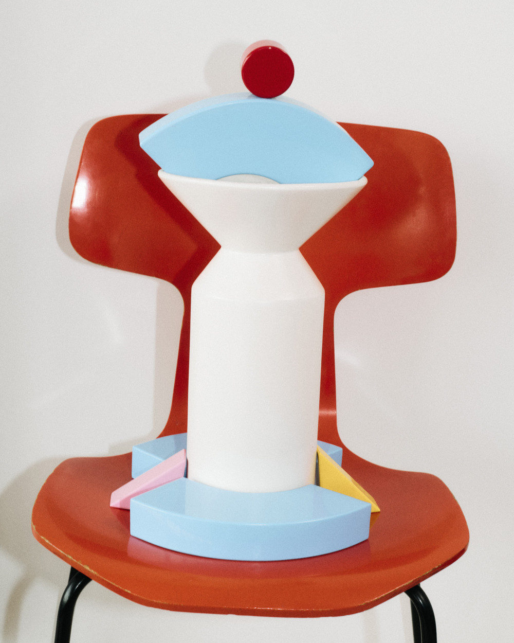 Layered arrangement of colorful geometric units from the Little Family collection by nara.world forming a compact sculptural composition