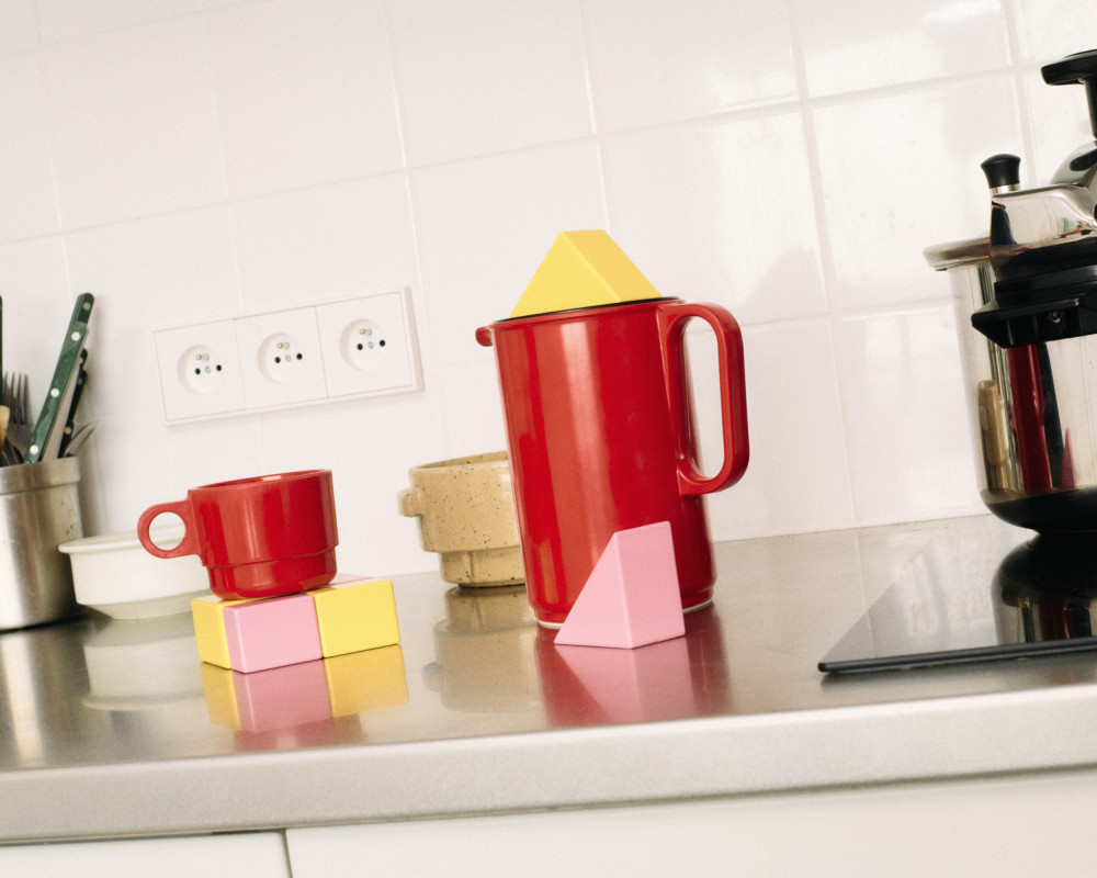 Modular elements from Little Family by nara.world used as functional supports for cups and kitchen objects